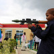A Somali boy plays with a toy model of a rocket-propelled grenade (RPG) after attending Eid al-Fitr prayers to mark the end of the fasting month of Ramadan in Somalia's capital Mogadishu, July 6, 2016.